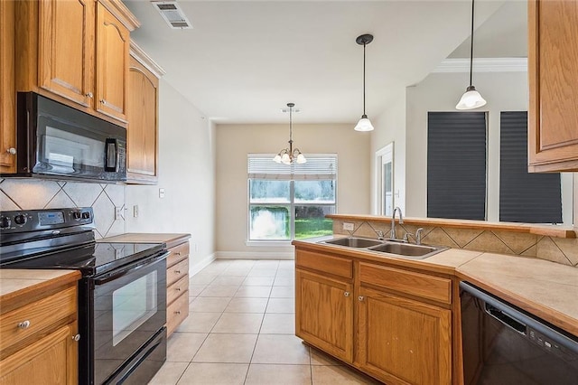 739 Chevreuil St, Mandeville, LA 70448 - kitchen featuring black appliances, decorative backsplash, hanging light fixtures, a chandelier, and crown molding
