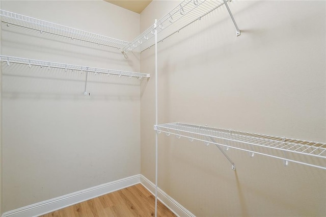 739 Chevreuil St, Mandeville, LA 70448 - walk in closet with wood finished floors