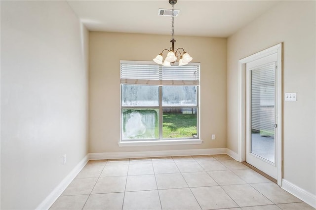 739 Chevreuil St, Mandeville, LA 70448 - unfurnished dining area featuring a chandelier and light tile patterned floors