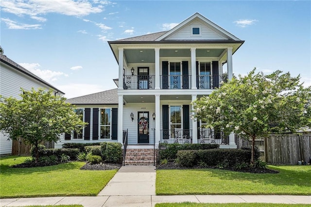 6818 Louisville St, New Orleans, LA 70124 - view of front of home featuring a porch, a balcony, and a shingled roof