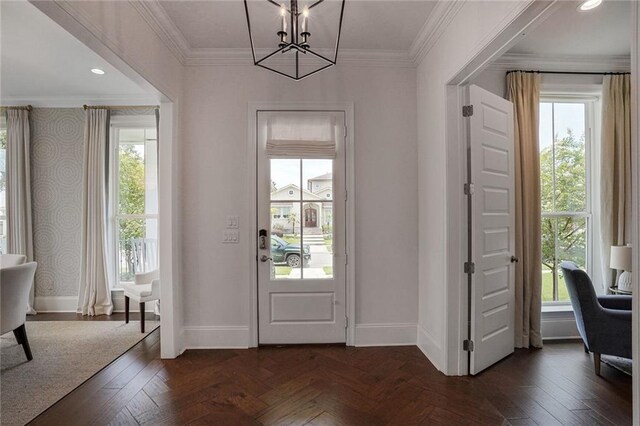 6818 Louisville St, New Orleans, LA 70124 - entrance foyer featuring a chandelier, healthy amount of natural light, and ornamental molding