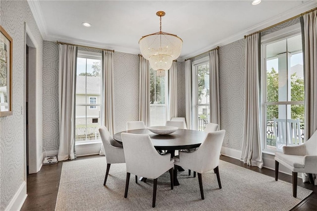 6818 Louisville St, New Orleans, LA 70124 - dining room featuring wallpapered walls, ornamental molding, dark wood-type flooring, a chandelier, and healthy amount of natural light