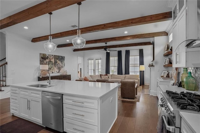 6818 Louisville St, New Orleans, LA 70124 - kitchen with stainless steel appliances, ceiling fan, recessed lighting, white cabinets, and light countertops