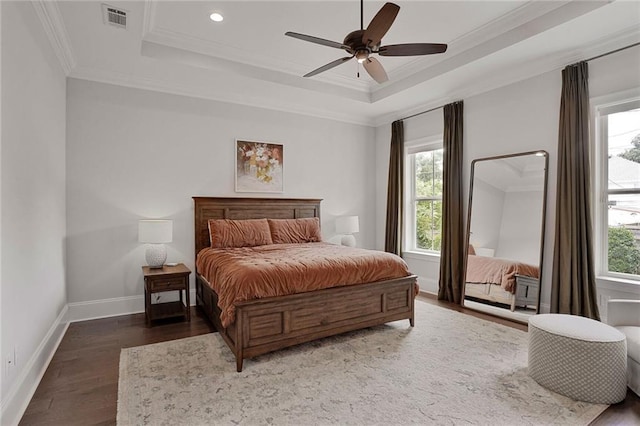 6818 Louisville St, New Orleans, LA 70124 - bedroom with a tray ceiling, multiple windows, crown molding, wood finished floors, and recessed lighting