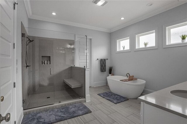 6818 Louisville St, New Orleans, LA 70124 - full bathroom featuring healthy amount of natural light, a shower stall, vanity, a soaking tub, and crown molding
