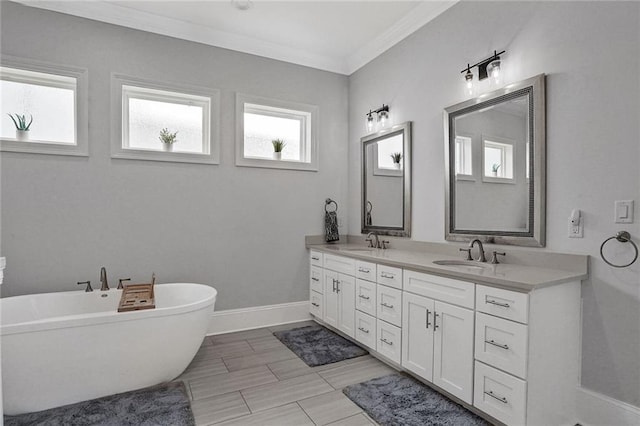 6818 Louisville St, New Orleans, LA 70124 - full bathroom featuring double vanity, a freestanding tub, and ornamental molding
