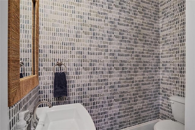 6818 Louisville St, New Orleans, LA 70124 - half bathroom featuring tile walls and toilet