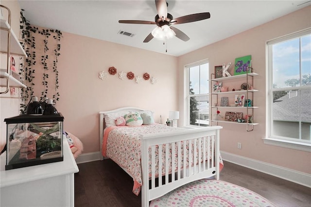 6818 Louisville St, New Orleans, LA 70124 - bedroom with wood finished floors, multiple windows, and a ceiling fan