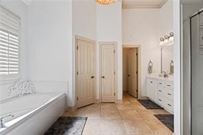 117 Grande Maison Blvd, Mandeville, LA 70471 - full bathroom with vanity, a stall shower, a garden tub, and tile patterned flooring