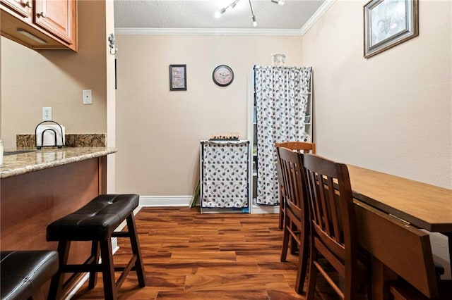 3805 Houma Blvd Unit C210, Metairie, LA 70006 - dining room featuring crown molding and dark wood-style floors