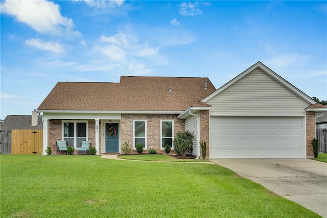 497 Jj Ln, Covington, LA 70433 - view of front of property featuring concrete driveway, an attached garage, brick siding, and roof with shingles