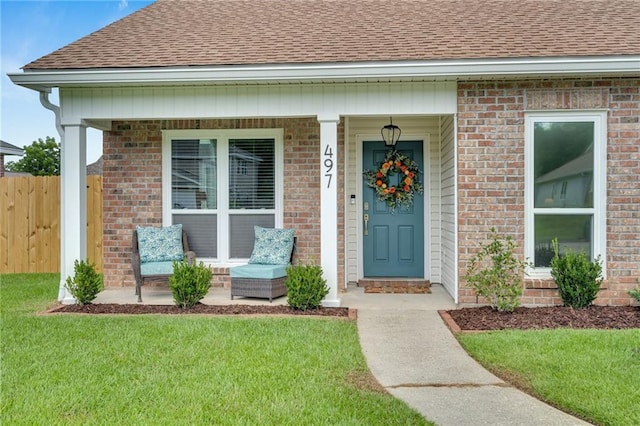 497 Jj Ln, Covington, LA 70433 - entrance to property with roof with shingles, a porch, and brick siding