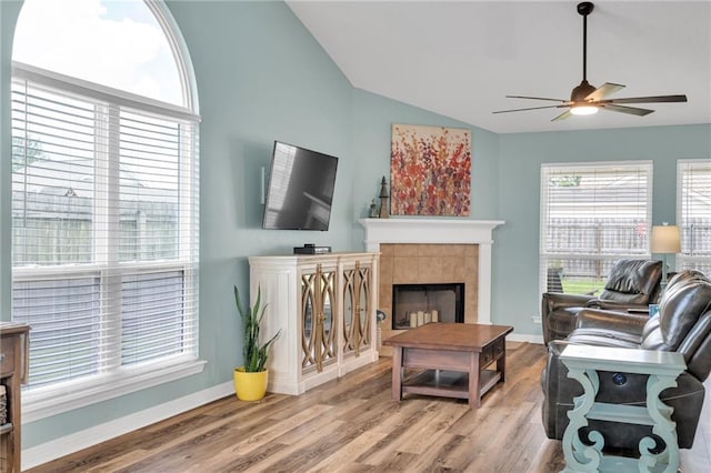 497 Jj Ln, Covington, LA 70433 - living room featuring ceiling fan, vaulted ceiling, wood finished floors, and a fireplace