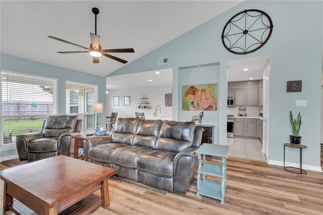 497 Jj Ln, Covington, LA 70433 - living area with ceiling fan, light wood-type flooring, and high vaulted ceiling