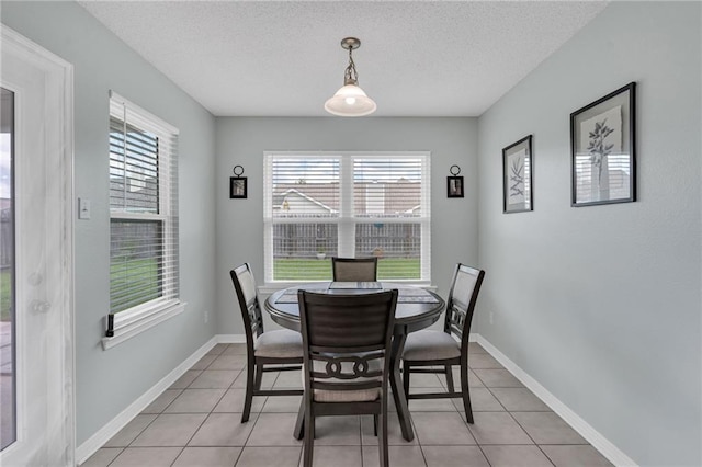 497 Jj Ln, Covington, LA 70433 - dining space featuring plenty of natural light, a textured ceiling, and light tile patterned floors