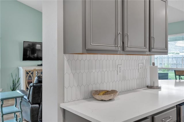 497 Jj Ln, Covington, LA 70433 - kitchen with gray cabinets, tasteful backsplash, and light stone counters