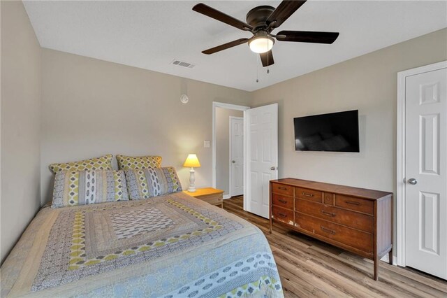 497 Jj Ln, Covington, LA 70433 - bedroom featuring wood finished floors and ceiling fan