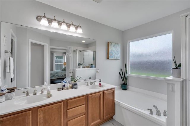 497 Jj Ln, Covington, LA 70433 - full bathroom with a stall shower, double vanity, a bath, and ensuite bath