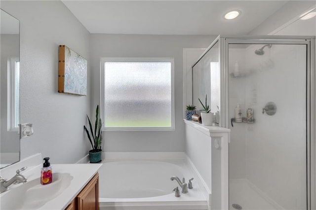 497 Jj Ln, Covington, LA 70433 - bathroom with vanity, a stall shower, and a garden tub