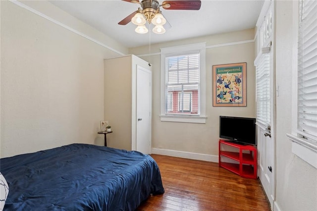 3221 N Rampart St, New Orleans, LA 70117 - bedroom with hardwood / wood-style flooring and a ceiling fan