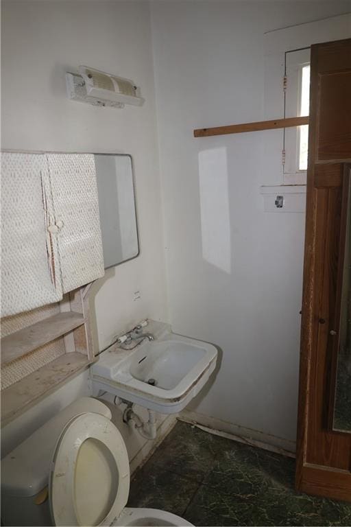 5326 Prytania St, New Orleans, LA 70115 - half bathroom with toilet and a sink