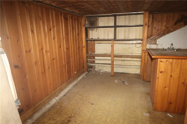 5326 Prytania St, New Orleans, LA 70115 - below grade area featuring wood walls and bar with sink