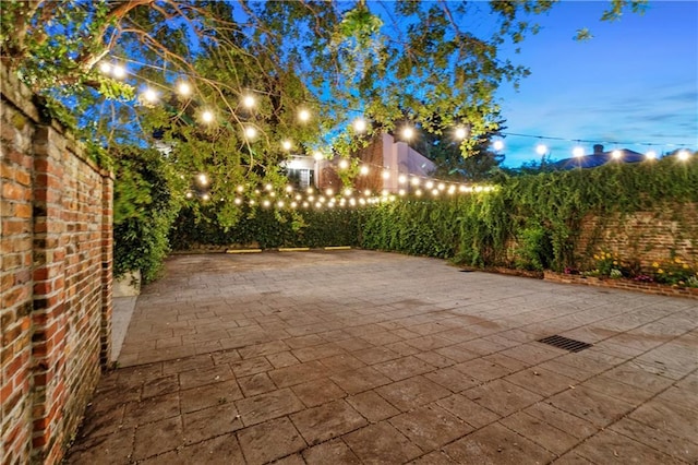 521 Dauphine St, New Orleans, LA 70112 - patio at night with a patio and a fenced backyard