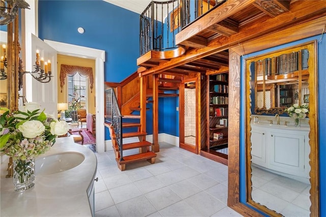 521 Dauphine St, New Orleans, LA 70112 - foyer featuring stairway and tile patterned floors