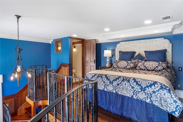 521 Dauphine St, New Orleans, LA 70112 - bedroom featuring crown molding, wainscoting, and recessed lighting