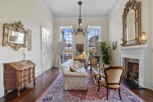 521 Dauphine St, New Orleans, LA 70112 - living area with wood finished floors, a fireplace, a chandelier, and ornamental molding