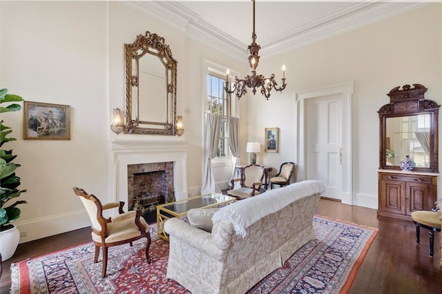 521 Dauphine St, New Orleans, LA 70112 - living area with a fireplace, wood finished floors, a chandelier, and crown molding