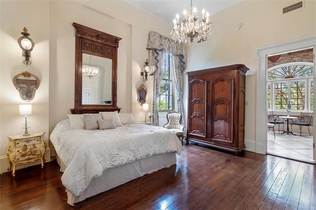 521 Dauphine St, New Orleans, LA 70112 - bedroom with a chandelier, dark wood-style floors, and a towering ceiling