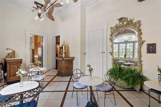 521 Dauphine St, New Orleans, LA 70112 - dining space with inlaid floor details, a chandelier, ornamental molding, light tile patterned floors, and a towering ceiling