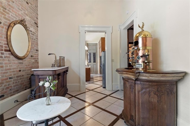 521 Dauphine St, New Orleans, LA 70112 - hall featuring inlaid floor details, light tile patterned floors, and a towering ceiling