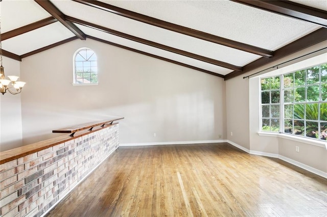 104 Magnolia Dr, Belle Chasse, LA 70037 - unfurnished room with wood finished floors and a chandelier