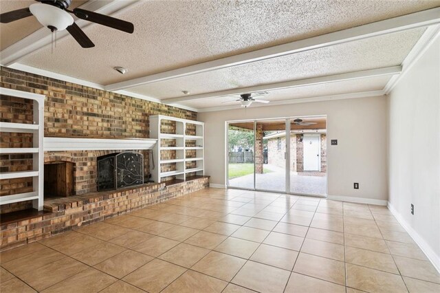 104 Magnolia Dr, Belle Chasse, LA 70037 - unfurnished living room with ceiling fan, tile patterned flooring, a brick fireplace, a textured ceiling, and crown molding