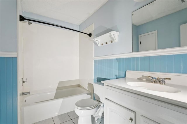 104 Magnolia Dr, Belle Chasse, LA 70037 - full bathroom featuring vanity, tile patterned floors, a wainscoted wall, and shower / bath combination