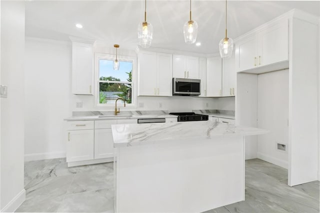 541 Jefferson Park Ave, Jefferson, LA 70121 - kitchen with stainless steel microwave, white cabinets, stove, recessed lighting, and a kitchen island