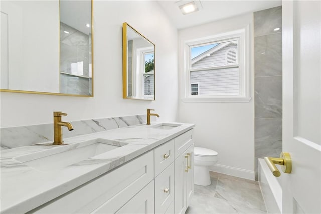 541 Jefferson Park Ave, Jefferson, LA 70121 - bathroom with double vanity, marble finish floors, and bathing tub / shower combination