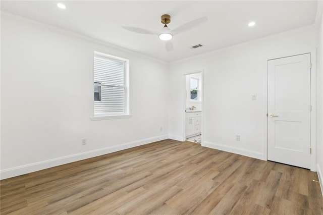 541 Jefferson Park Ave, Jefferson, LA 70121 - unfurnished bedroom with crown molding, light wood-style flooring, ensuite bathroom, recessed lighting, and ceiling fan