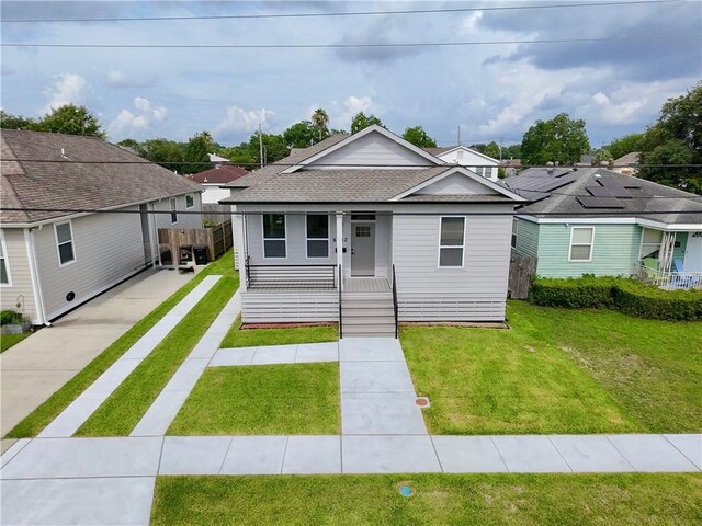 6032 Wingate Dr, New Orleans, LA 70122 - view of front of property featuring a porch and roof with shingles