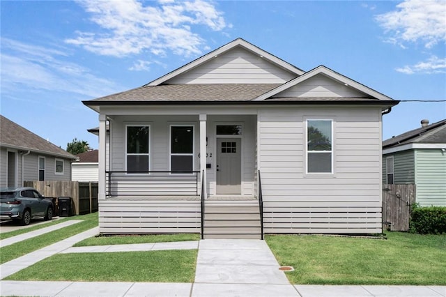 6032 Wingate Dr, New Orleans, LA 70122 - bungalow-style house featuring covered porch and a shingled roof