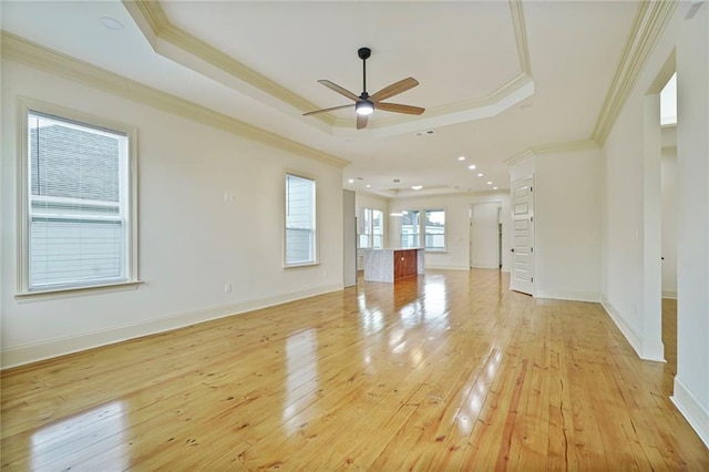 6032 Wingate Dr, New Orleans, LA 70122 - unfurnished room with ceiling fan, a raised ceiling, crown molding, light wood-style floors, and recessed lighting