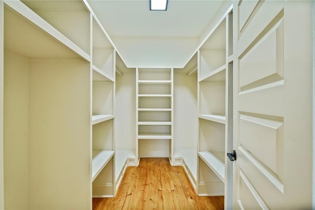 6032 Wingate Dr, New Orleans, LA 70122 - walk in closet featuring hardwood / wood-style floors