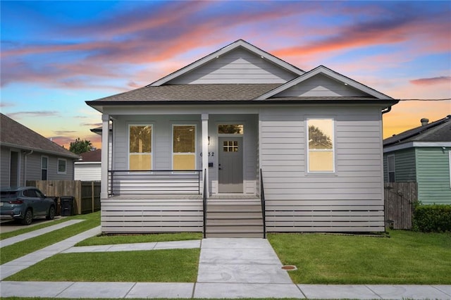 6032 Wingate Dr, New Orleans, LA 70122 - view of front facade featuring covered porch and roof with shingles