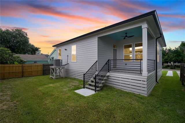 6032 Wingate Dr, New Orleans, LA 70122 - rear view of house featuring a fenced backyard and a ceiling fan