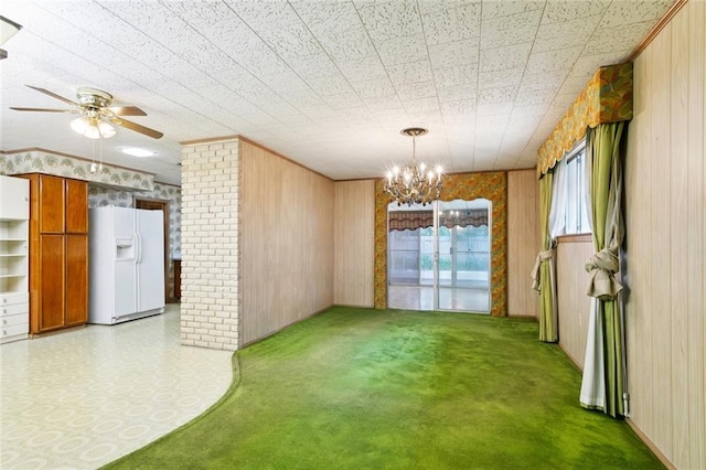 953 Homestead Ave, Metairie, LA 70005 - unfurnished dining area with wooden walls, a chandelier, carpet flooring, and ceiling fan