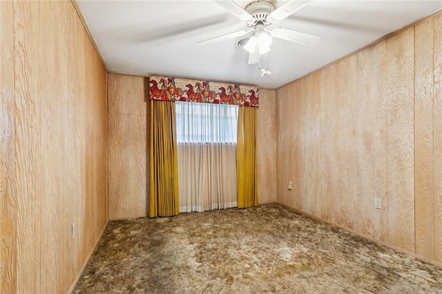 953 Homestead Ave, Metairie, LA 70005 - unfurnished room featuring carpet, a ceiling fan, and wooden walls