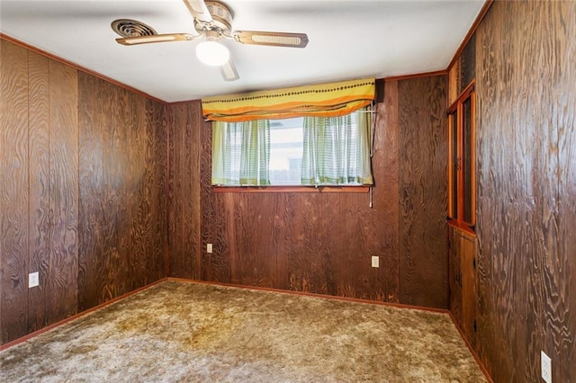 953 Homestead Ave, Metairie, LA 70005 - carpeted empty room with wooden walls and ceiling fan