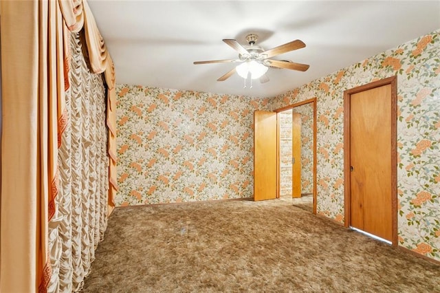 953 Homestead Ave, Metairie, LA 70005 - unfurnished bedroom featuring wallpapered walls, carpet flooring, and a ceiling fan